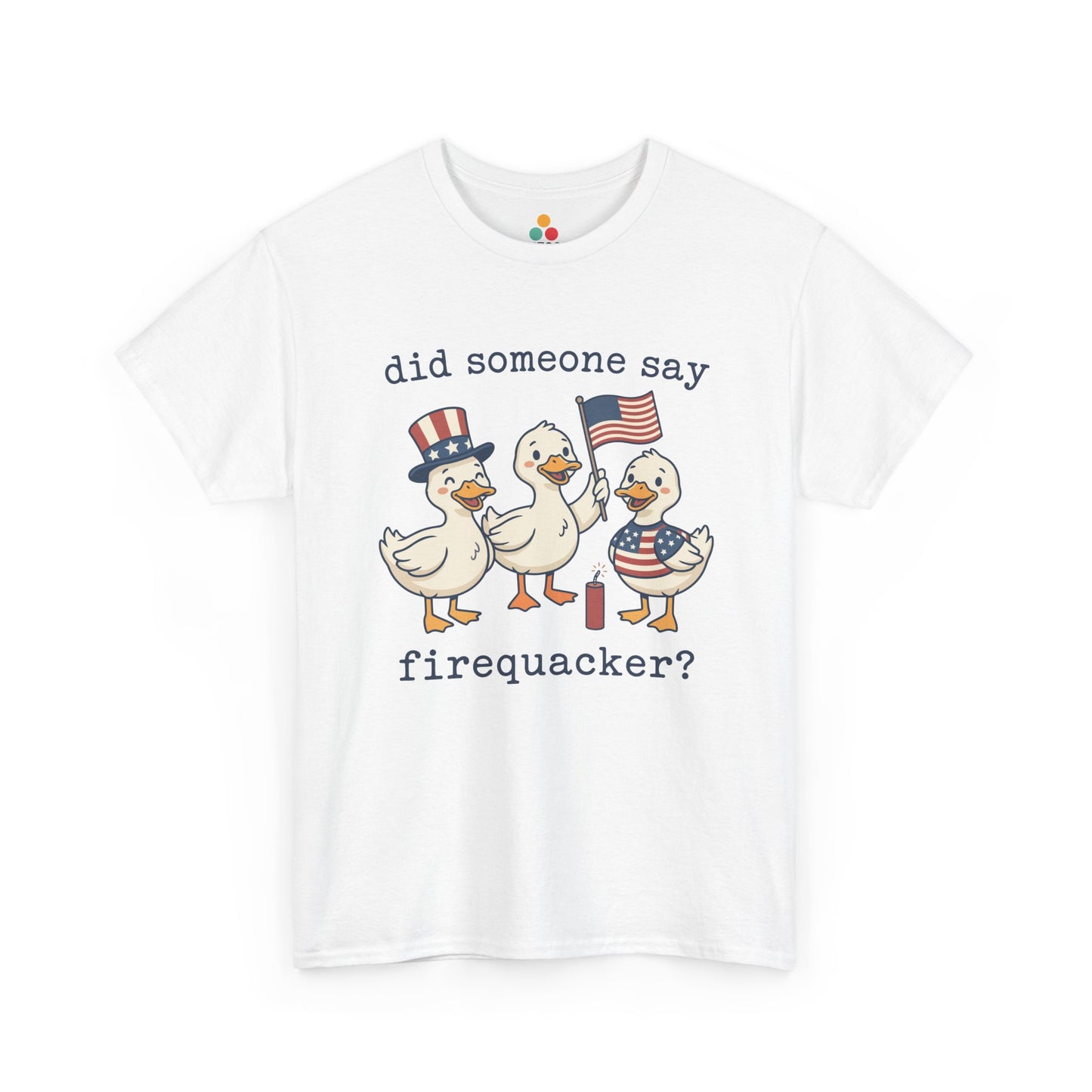 White TEEZOCA T-shirt featuring three cartoon patriotic ducks — one in an Uncle Sam hat, one holding a US flag, and one in a stars-and-stripes outfit — around a firecracker with the text "did someone say firequacker?" printed above and below.

