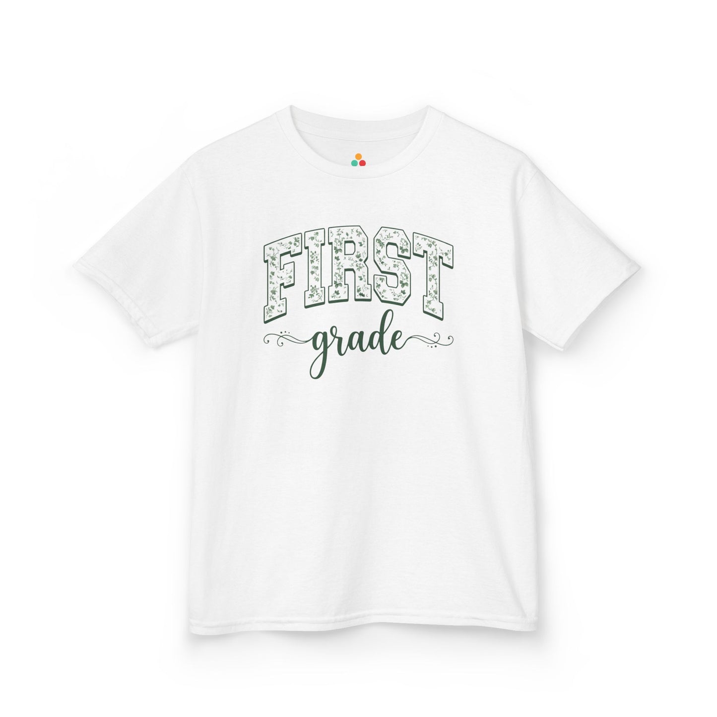 White t-shirt with 'FIRST grade' text on a white background. TEEZOCA floral first grade girl shirt, the kind of kids first-day tee parents shop on Amazon and Etsy for milestone photos.
