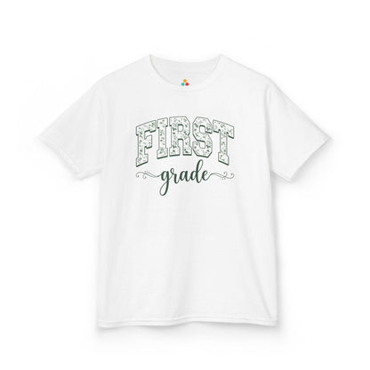White t-shirt with 'FIRST grade' text on a white background. TEEZOCA floral first grade girl shirt, the kind of kids first-day tee parents shop on Amazon and Etsy for milestone photos.

