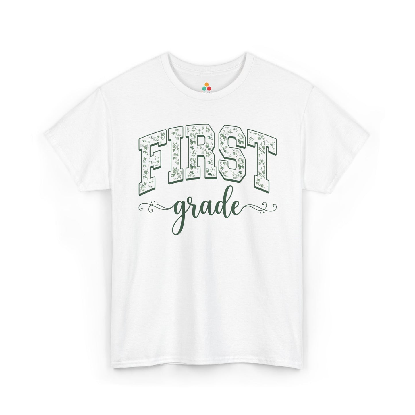 White t-shirt with 'FIRST grade' text on a white background TEEZOCA floral first grade shirt for adults, the kind of teacher tee shoppers find on teezoca.com for the new school year.
