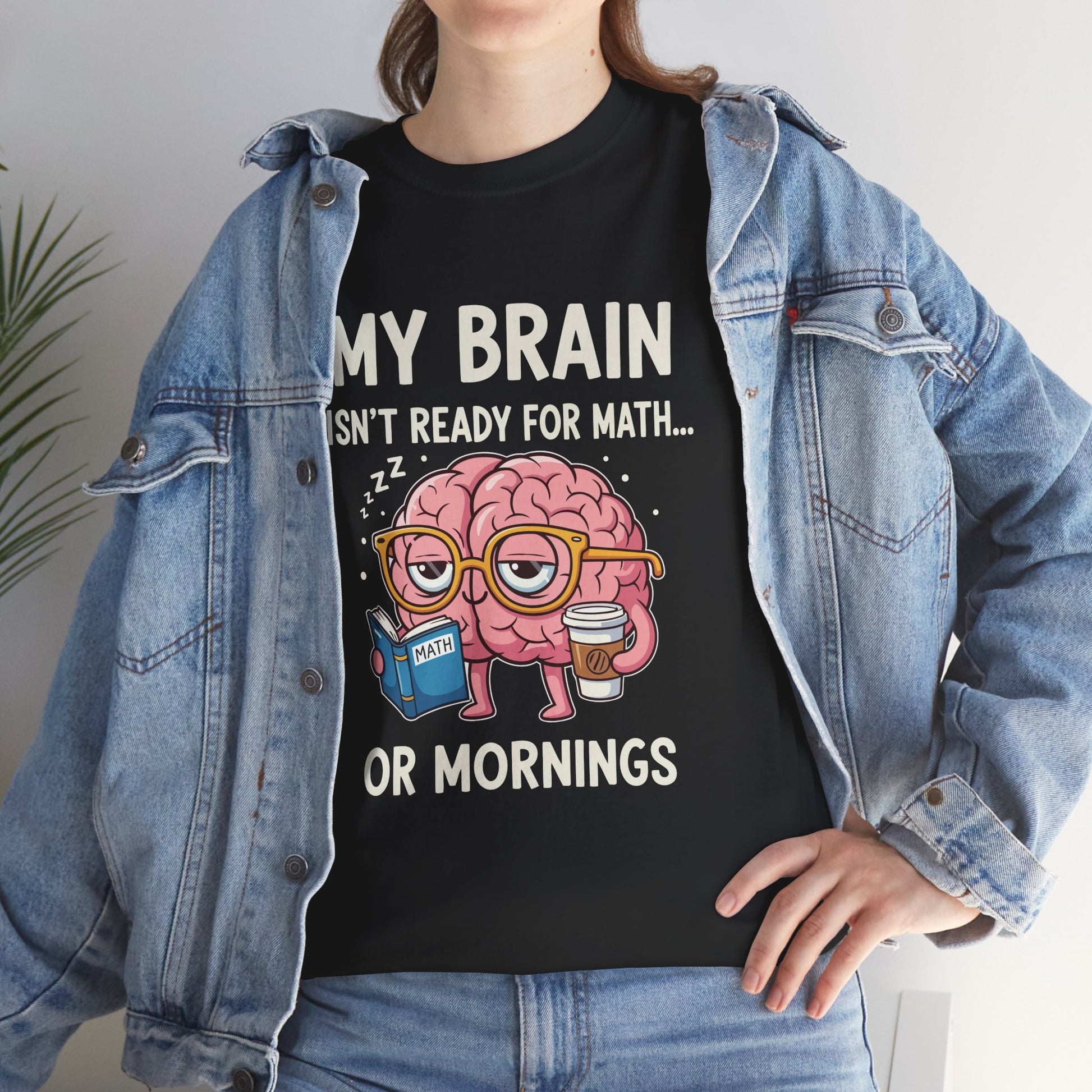 Woman in a denim jacket styling a TEEZOCA “My Brain Isn’t Ready For Math Or Mornings” funny teacher tee.