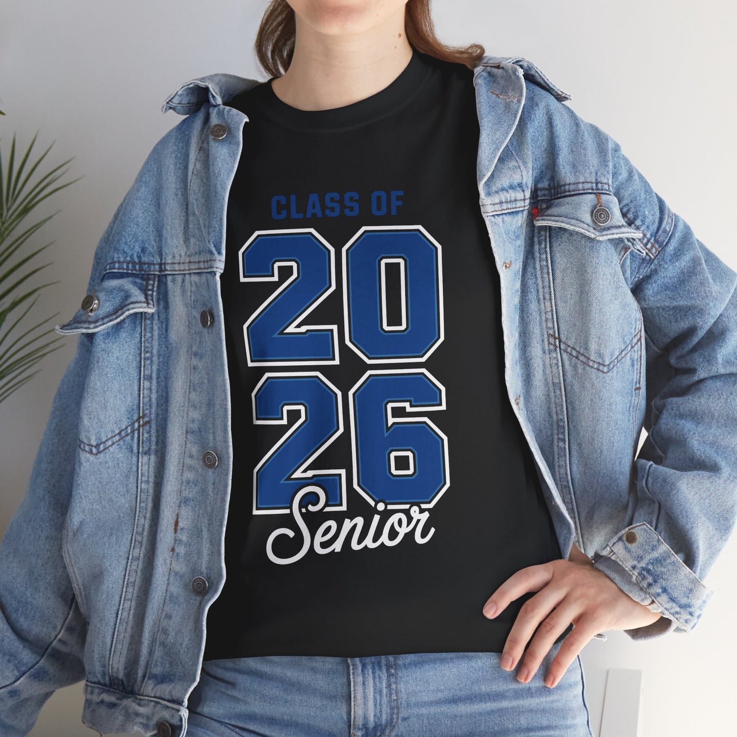 Woman in a denim jacket styling a black TEEZOCA Class of 2026 blue numbers senior tee.