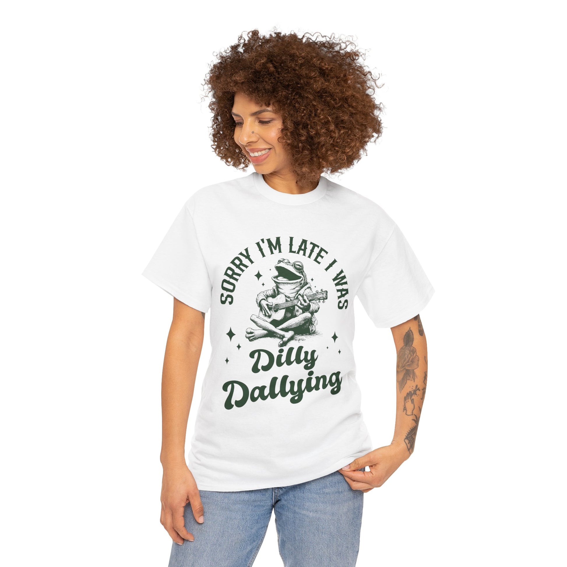 “Woman model in Teezoca Sorry I’m Late I Was Dilly Dallying frog guitar shirt, procrastination humor, light-hearted lateness design, white unisex tee”


