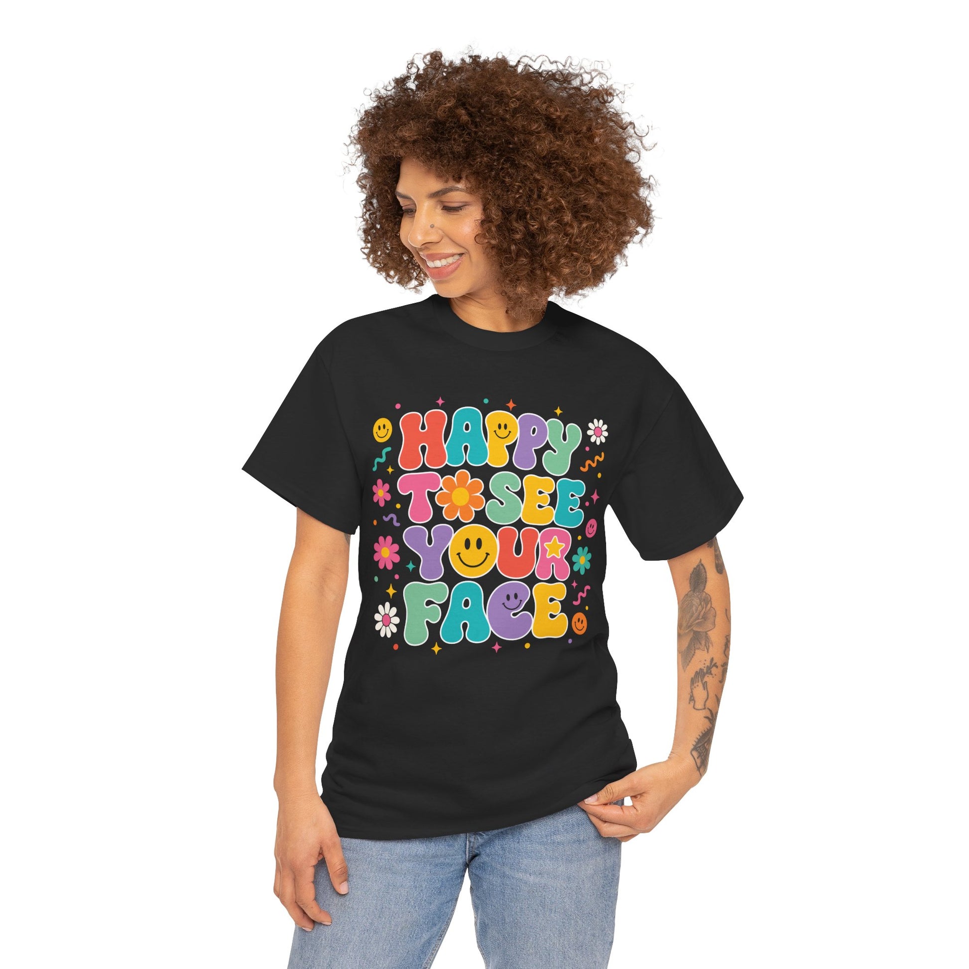Woman teacher wearing a black TEEZOCA Happy to See Your Face groovy t-shirt, a cute retro back to school tee for teachers.
