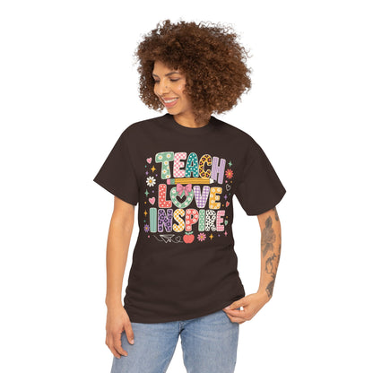 Woman teacher wearing a dark chocolate TEEZOCA Teach Love Inspire t-shirt, a cute back to school tee for teachers.
