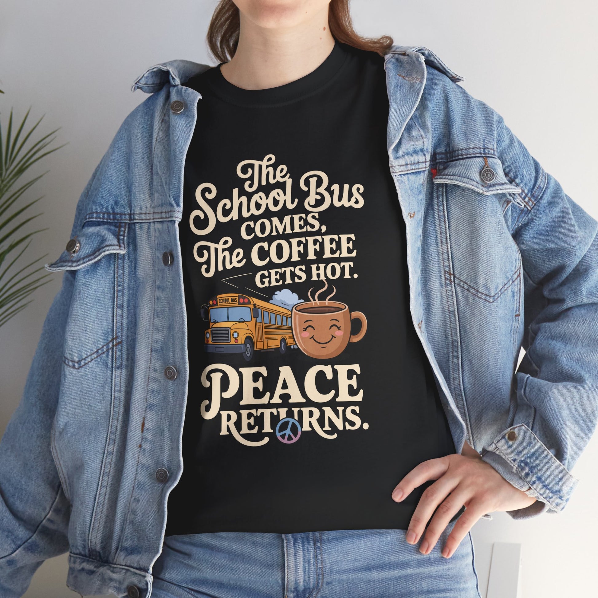 Woman wearing TEEZOCA black “Coffee Hot Peace” parent shirt under denim jacket.