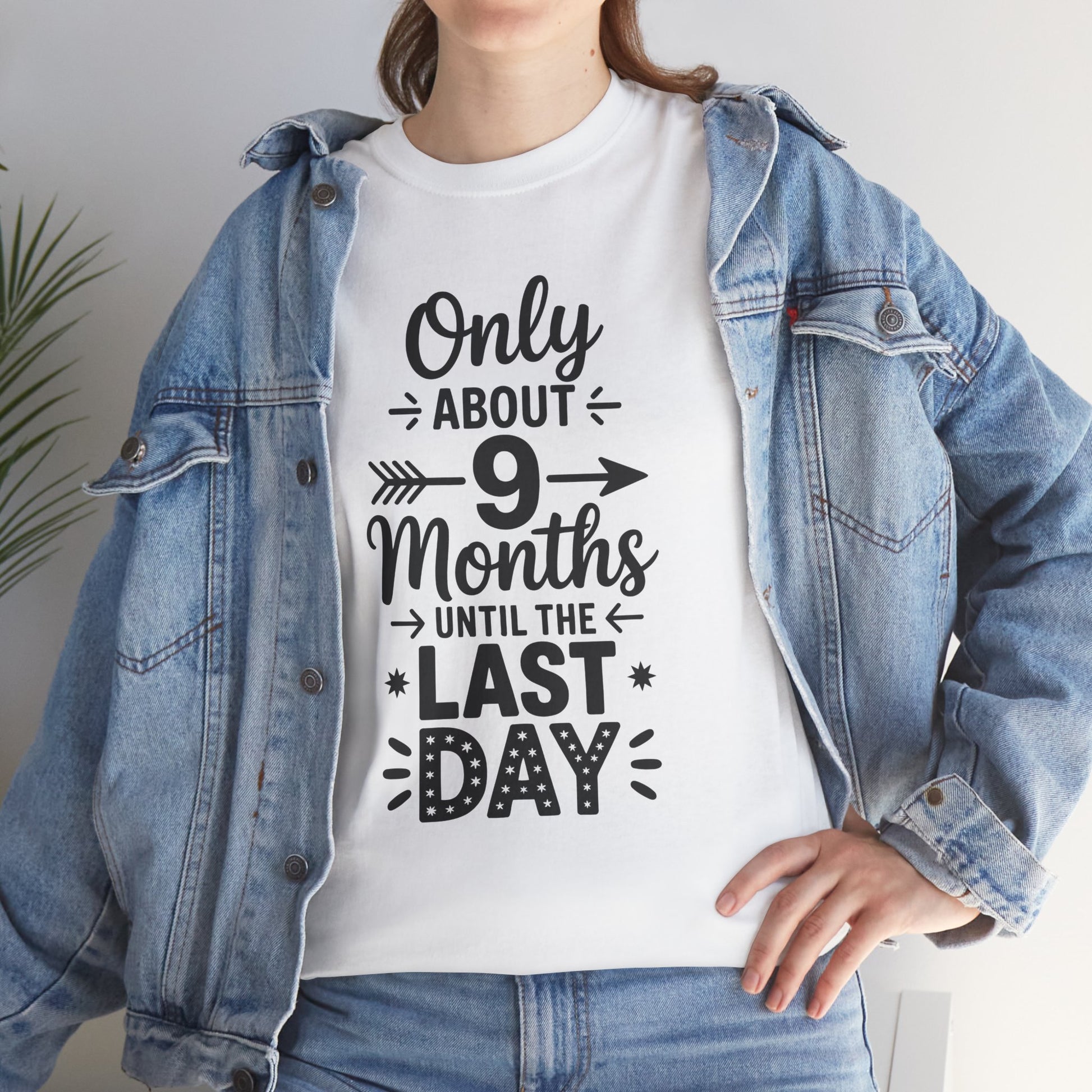 Woman wearing TEEZOCA white countdown school tee under denim jacket.