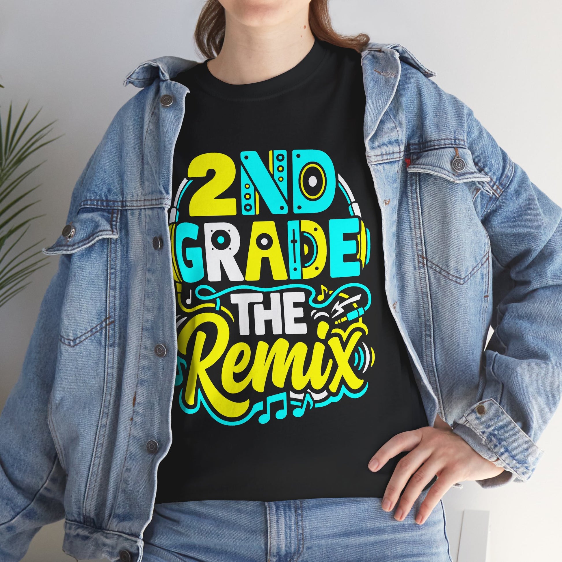 Woman wearing a black TEEZOCA funny DJ teacher shirt styled casually underneath a blue denim jacket.