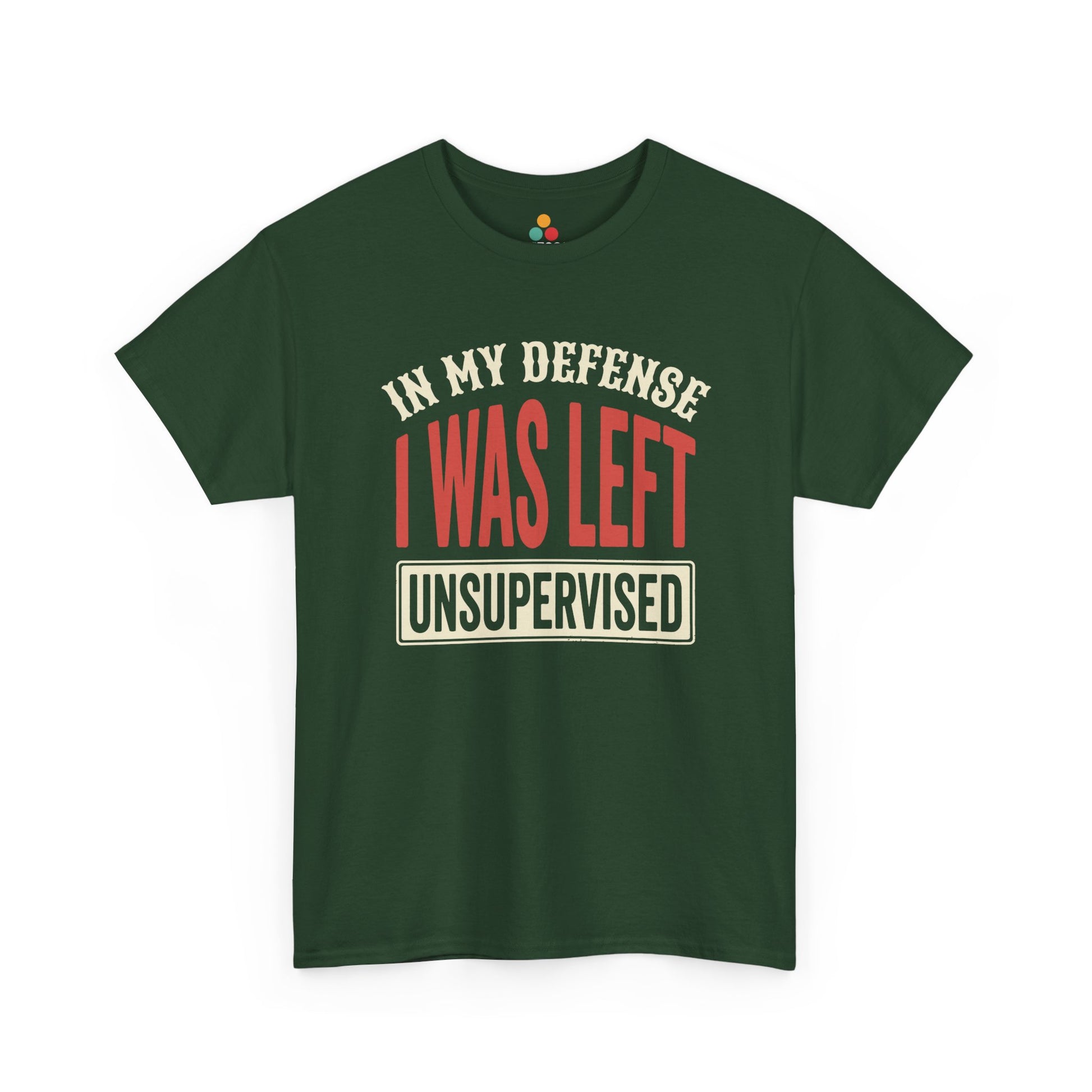 a Forest Green T-shirt featuring the phrase “In My Defense I Was Left Unsupervised” in bold red and cream retro-style text, funny sarcastic quote shirt, witty statement tee, dry humor graphic tee, adult humor apparel, retro typography shirt, bold statement shirt, playful sarcasm tee, humorous quote t-shirt, chaos humor shirt, and funny novelty graphic tee.

