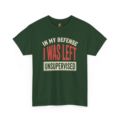 a Forest Green T-shirt featuring the phrase “In My Defense I Was Left Unsupervised” in bold red and cream retro-style text, funny sarcastic quote shirt, witty statement tee, dry humor graphic tee, adult humor apparel, retro typography shirt, bold statement shirt, playful sarcasm tee, humorous quote t-shirt, chaos humor shirt, and funny novelty graphic tee.

