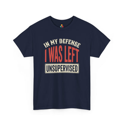 a Navy BLUE T-shirt featuring the phrase “In My Defense I Was Left Unsupervised” in bold red and cream retro-style text, funny sarcastic quote shirt, witty statement tee, dry humor graphic tee, adult humor apparel, retro typography shirt, bold statement shirt, playful sarcasm tee, humorous quote t-shirt, chaos humor shirt, and funny novelty graphic tee.

