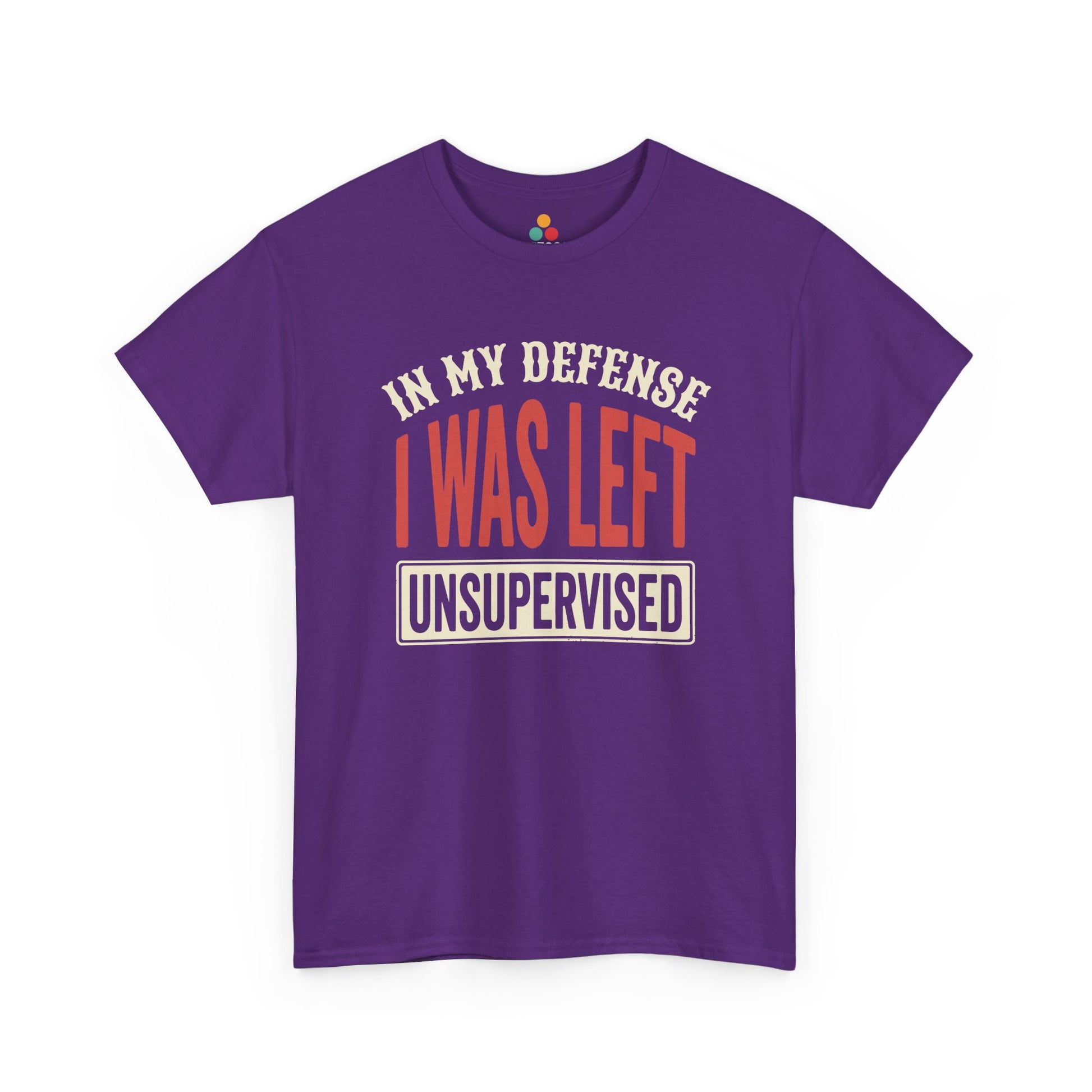 a Purple T-shirt featuring the phrase “In My Defense I Was Left Unsupervised” in bold red and cream retro-style text, funny sarcastic quote shirt, witty statement tee, dry humor graphic tee, adult humor apparel, retro typography shirt, bold statement shirt, playful sarcasm tee, humorous quote t-shirt, chaos humor shirt, and funny novelty graphic tee.

