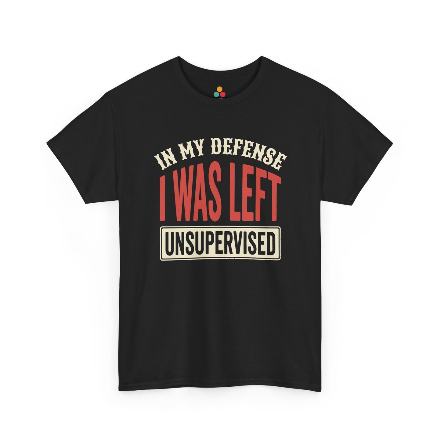 a dark T-shirt featuring the phrase “In My Defense I Was Left Unsupervised” in bold red and cream retro-style text, funny sarcastic quote shirt, witty statement tee, dry humor graphic tee, adult humor apparel, retro typography shirt, bold statement shirt, playful sarcasm tee, humorous quote t-shirt, chaos humor shirt, and funny novelty graphic tee.

