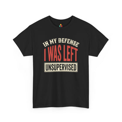 a dark T-shirt featuring the phrase “In My Defense I Was Left Unsupervised” in bold red and cream retro-style text, funny sarcastic quote shirt, witty statement tee, dry humor graphic tee, adult humor apparel, retro typography shirt, bold statement shirt, playful sarcasm tee, humorous quote t-shirt, chaos humor shirt, and funny novelty graphic tee.


