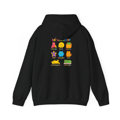 Flat lay of black hoodie displaying vibrant cat geometry art and labeled shapes, highlighting the playful and educational graphic for math and science fans.