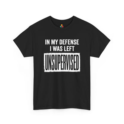  black T-shirt featuring bold white block typography reading "In My Defense I Was Left Unsupervised" with a highlighted "UNSUPERVISED" text box, funny sarcastic quote shirt, witty statement tee, dry humor graphic tee, and bold novelty quote apparel.