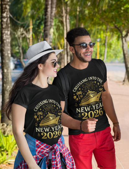 Couple wearing matching black “Cruising Into The New Year 2026” gold cruise ship T-shirts while walking outdoors, lifestyle photo.
