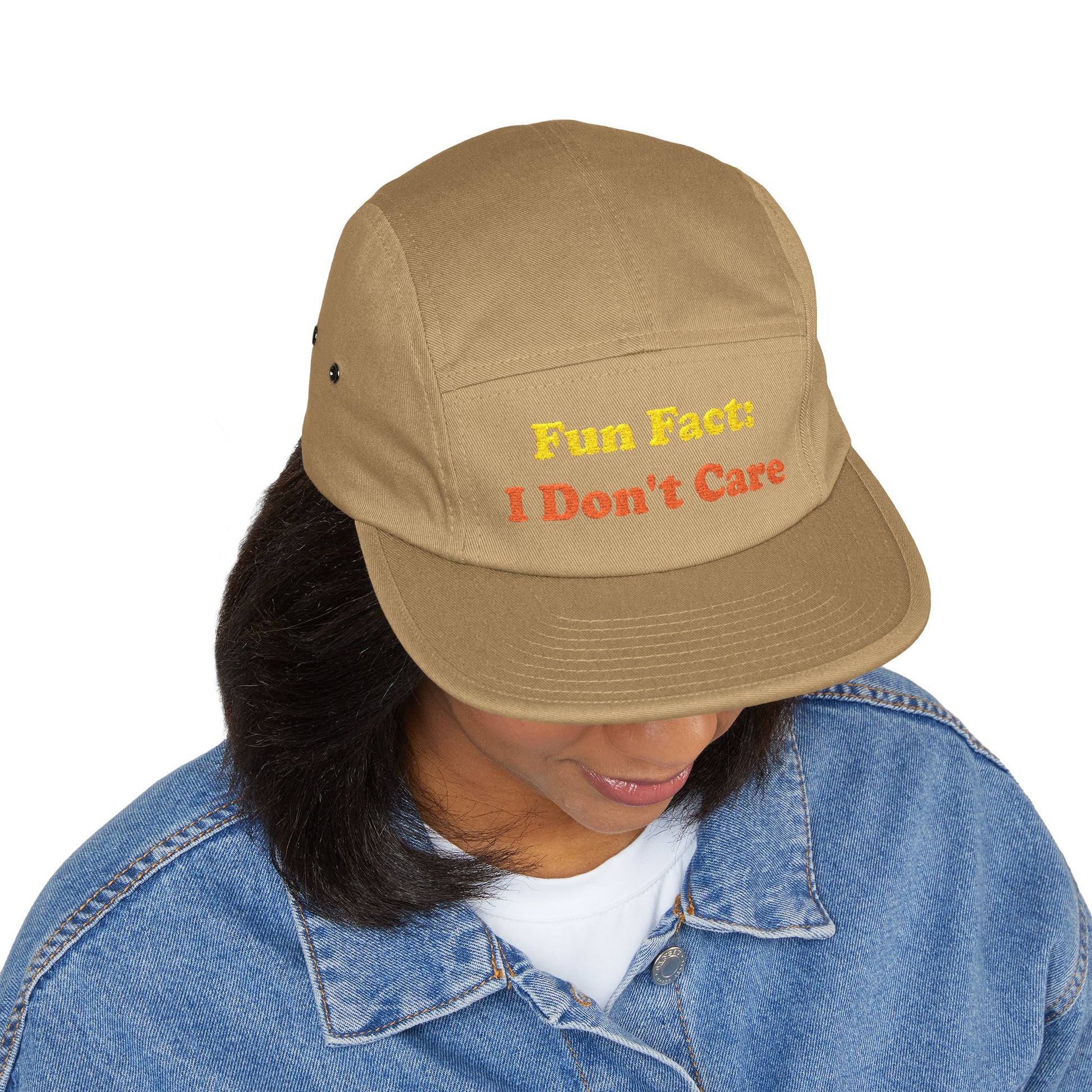 Tan "Fun Fact: I Don't Care" cap styled on woman in casual outfit—lifestyle shot demonstrating unisex appeal, women's fashion compatibility, and humorous attitude accessory versatility.