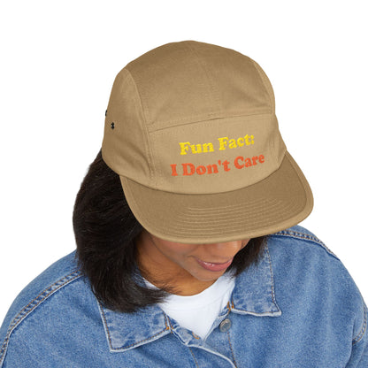 Tan "Fun Fact: I Don't Care" cap styled on woman in casual outfit—lifestyle shot demonstrating unisex appeal, women's fashion compatibility, and humorous attitude accessory versatility.