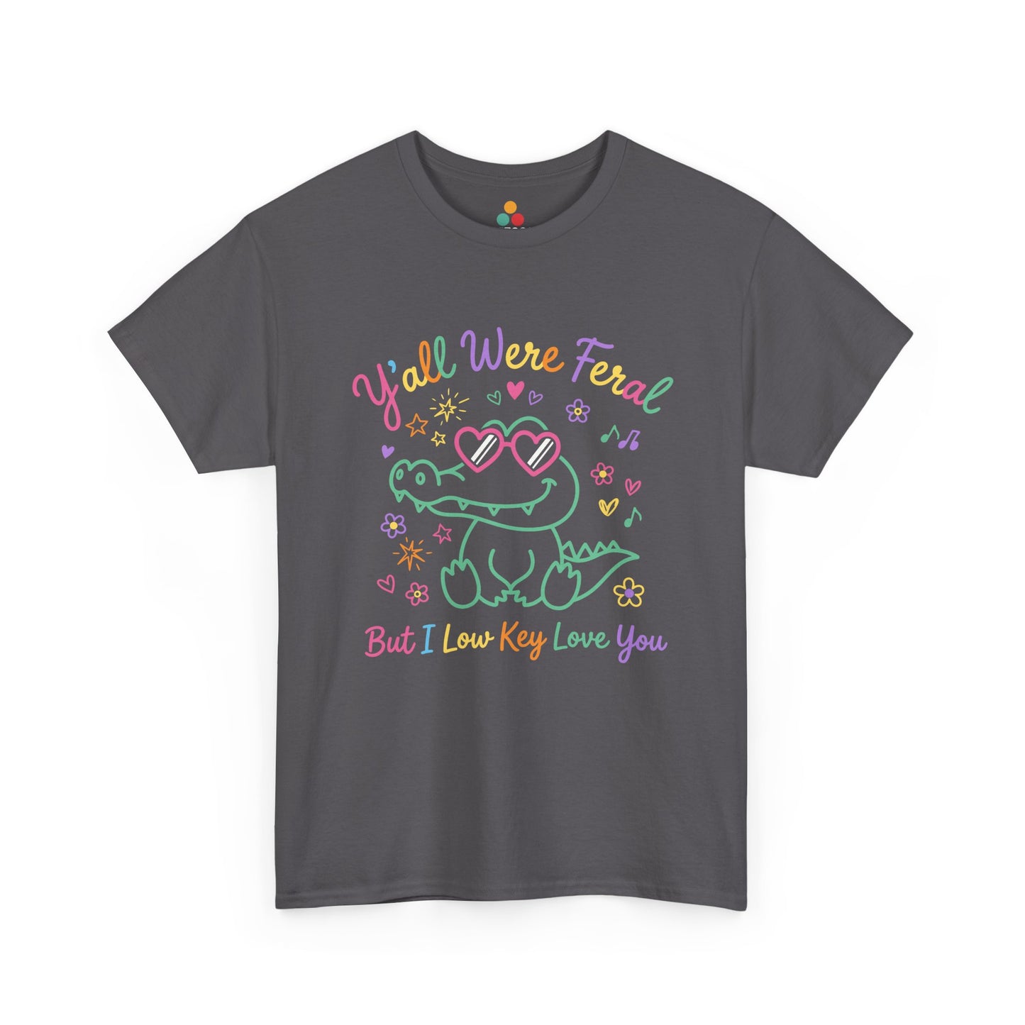 funny t-shirt  crocodile wearing heart-shaped sunglasses surrounded by colorful stars and flowers, with rainbow text reading "Y'all Were Feral But I Low Key Love You" — a funny last day of school teacher gift shirt.

