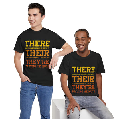 Male and female models dressed in “There Their They’re” grammar joke t-shirts, perfect for classroom wear, literacy events, and educational fun.