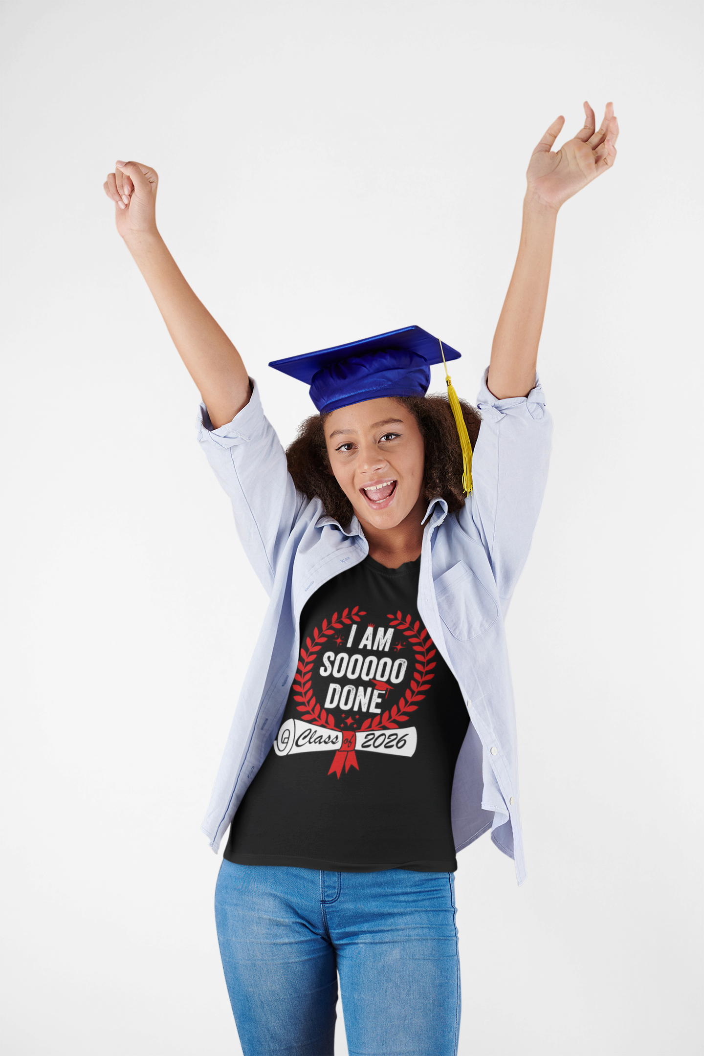  Excited female graduate raising her arms in the “I Am Soooo Done – Class 2026” t-shirt and cap, celebrating senior year and diploma.