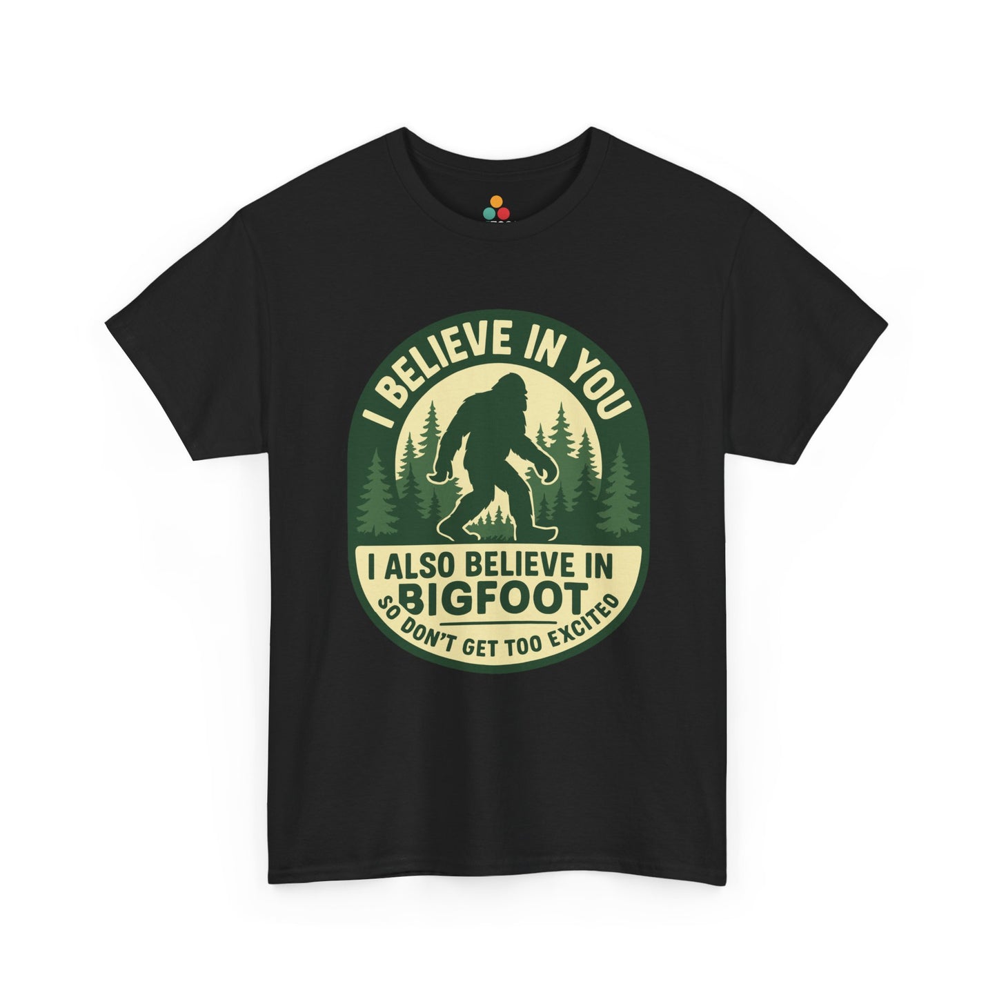  “Teezoca I Believe In You I Also Believe In Bigfoot t-shirt, black, retro cryptid forest badge, front view”


