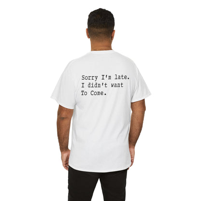 men wearing a Back Print of a Light Pink T-shirt featuring the phrase “Sorry I’m Late. I Didn’t Want To Come.” in clean black typewriter-style text, funny back print quote shirt, sarcastic statement tee, introvert humor graphic, and minimalist text design.

