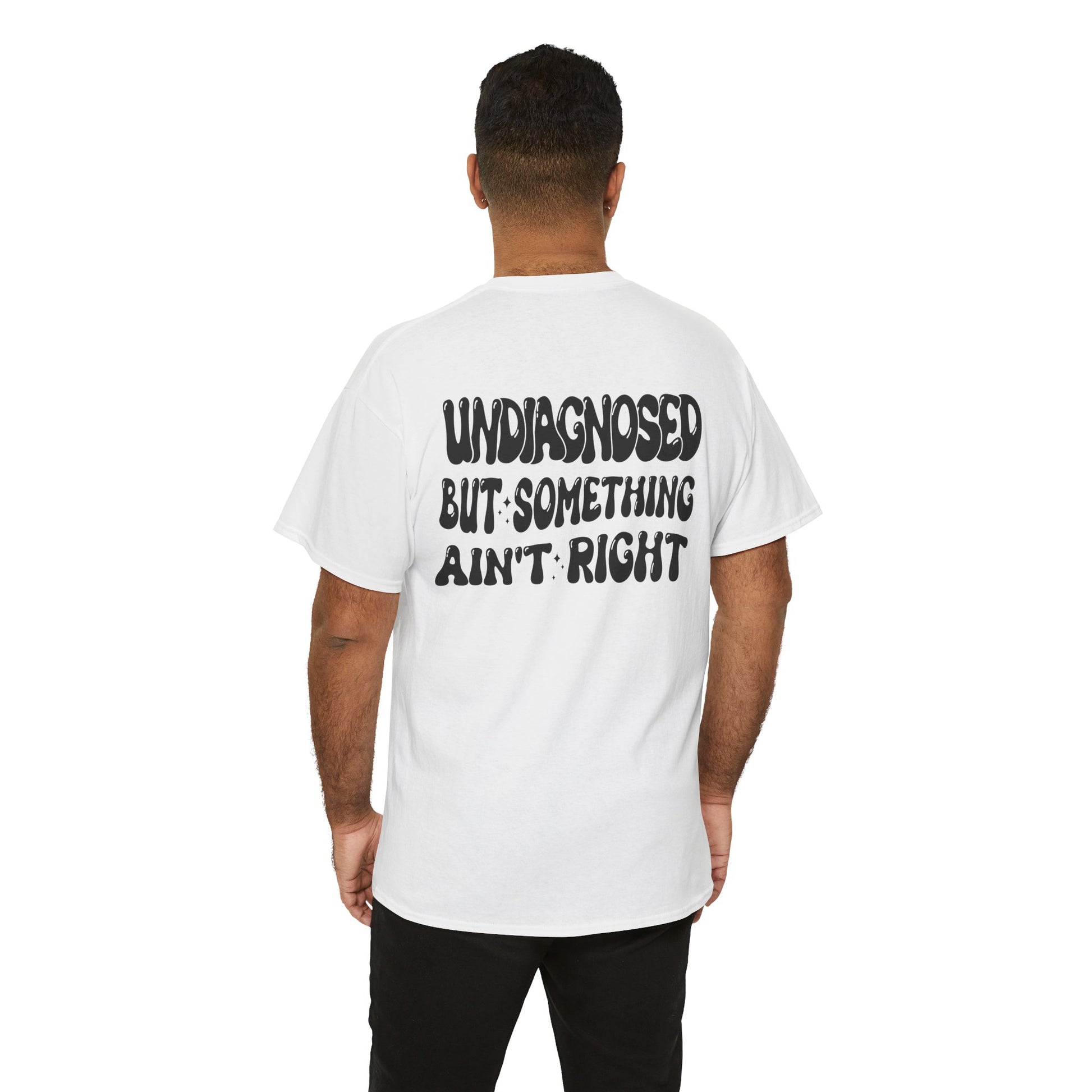 men wearing  a Back Print of a white T-shirt featuring the viral meme phrase "Undiagnosed But Something Ain't Right" in bold wavy retro typography, a trending funny mental health meme shirt, unhinged humor tee, therapy meme graphic, and relatable back print statement design.
