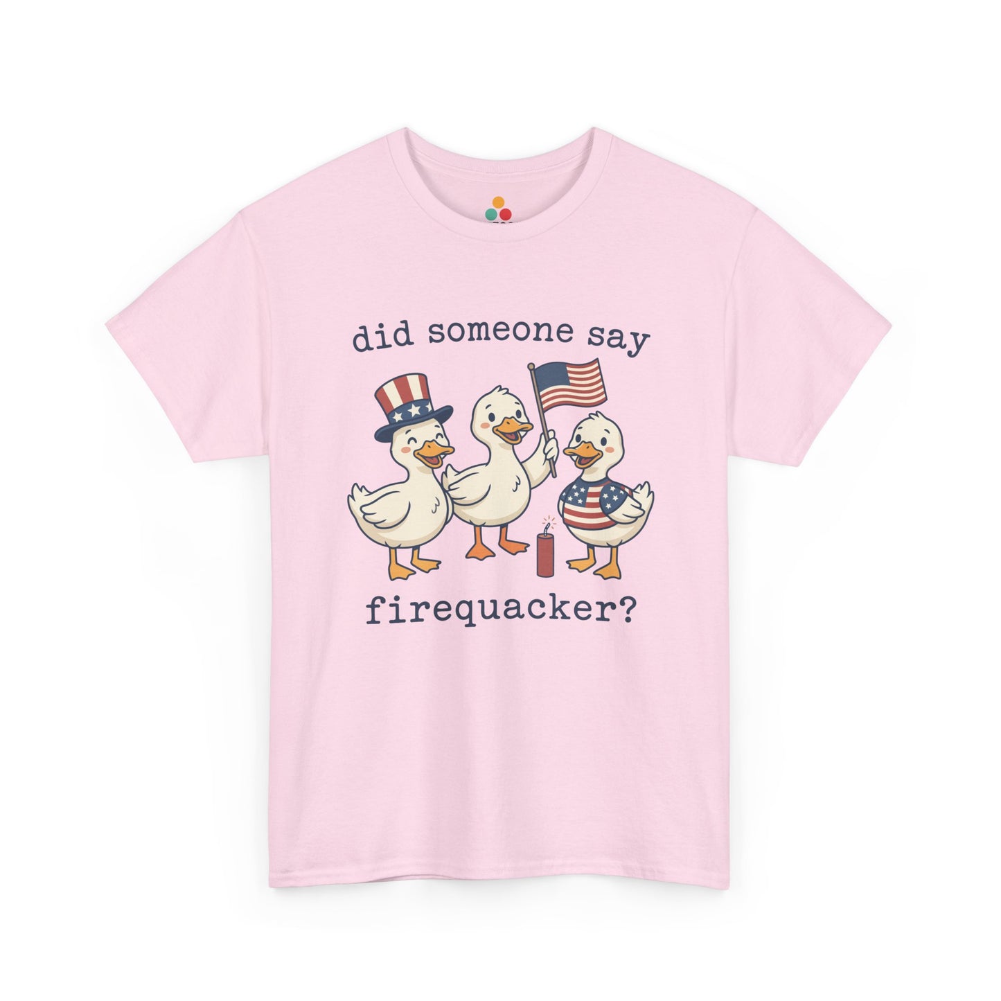 Pink TEEZOCA T-shirt featuring three cartoon patriotic ducks — one in an Uncle Sam hat, one holding a US flag, and one in a stars-and-stripes outfit — around a firecracker with the text "did someone say firequacker?" printed above and below.

