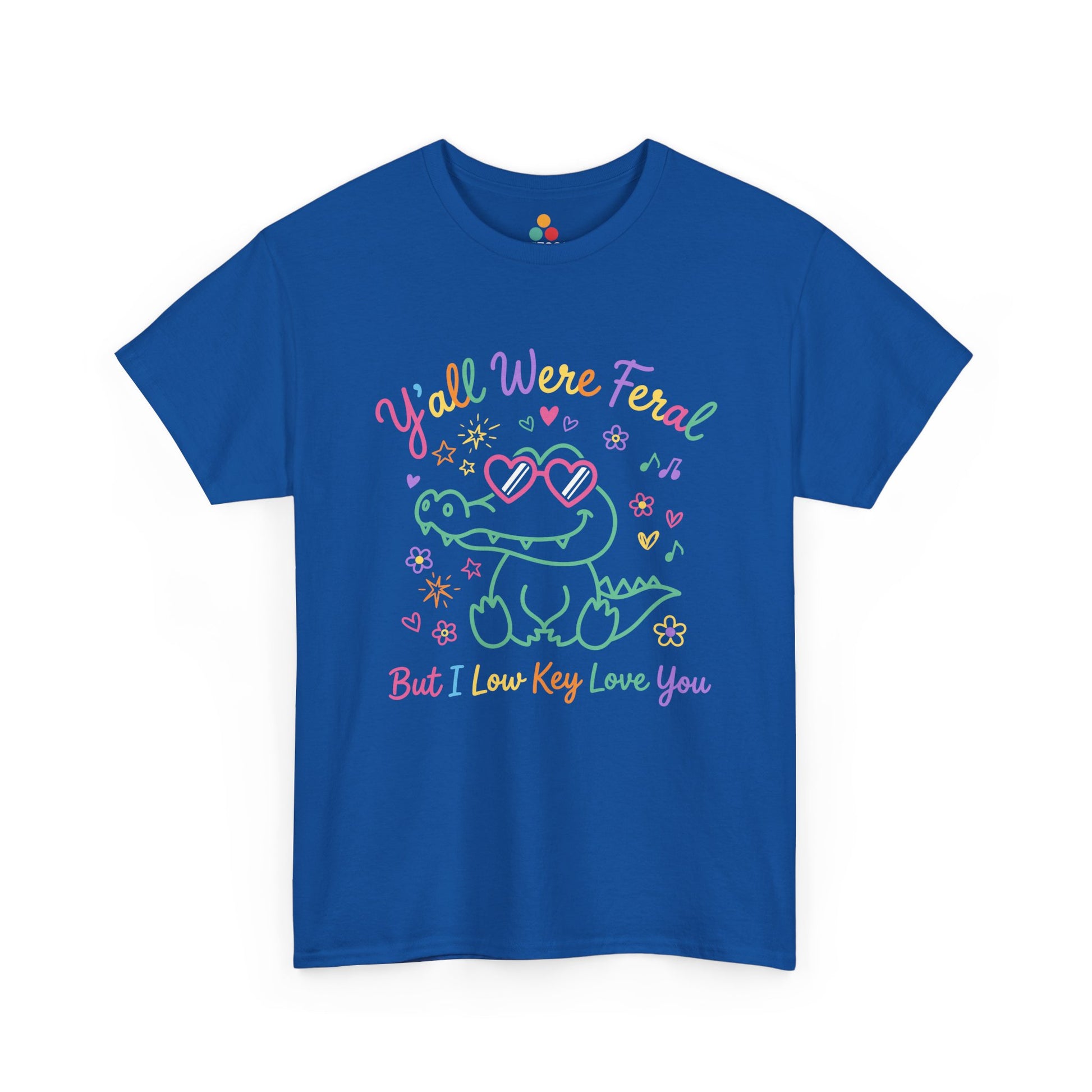  royal blue neon crocodile wearing heart-shaped sunglasses surrounded by colorful stars and flowers, with rainbow text reading "Y'all Were Feral But I Low Key Love You" — a funny last day of school teacher gift shirt.

