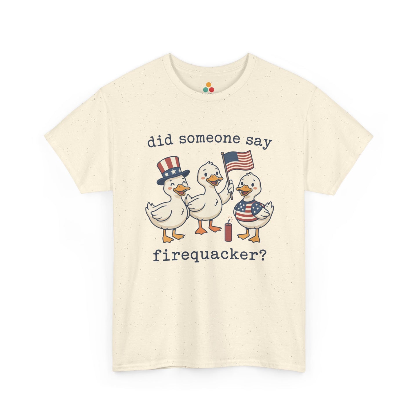 sand beige  TEEZOCA T-shirt featuring three cartoon patriotic ducks — one in an Uncle Sam hat, one holding a US flag, and one in a stars-and-stripes outfit — around a firecracker with the text "did someone say firequacker?" printed above and below.

