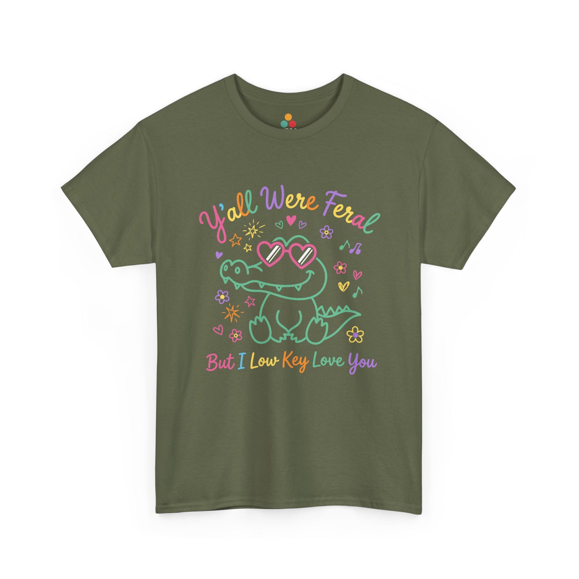t-shirt with crocodile wearing heart-shaped sunglasses surrounded by colorful stars and flowers, with rainbow text reading "Y'all Were Feral But I Low Key Love You" — a funny last day of school teacher gift shirt.

