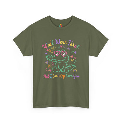 t-shirt with crocodile wearing heart-shaped sunglasses surrounded by colorful stars and flowers, with rainbow text reading "Y'all Were Feral But I Low Key Love You" — a funny last day of school teacher gift shirt.


