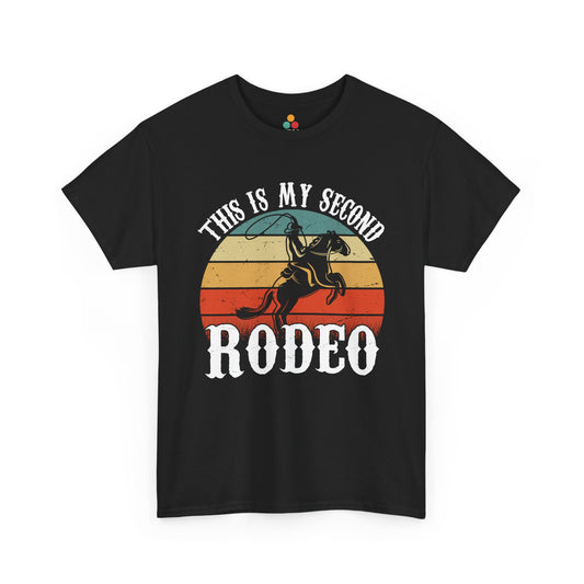 “Teezoca This Is My Second Rodeo shirt, vintage sunset circle with cowboy riding bucking horse, western humor graphic, black tee, front”

