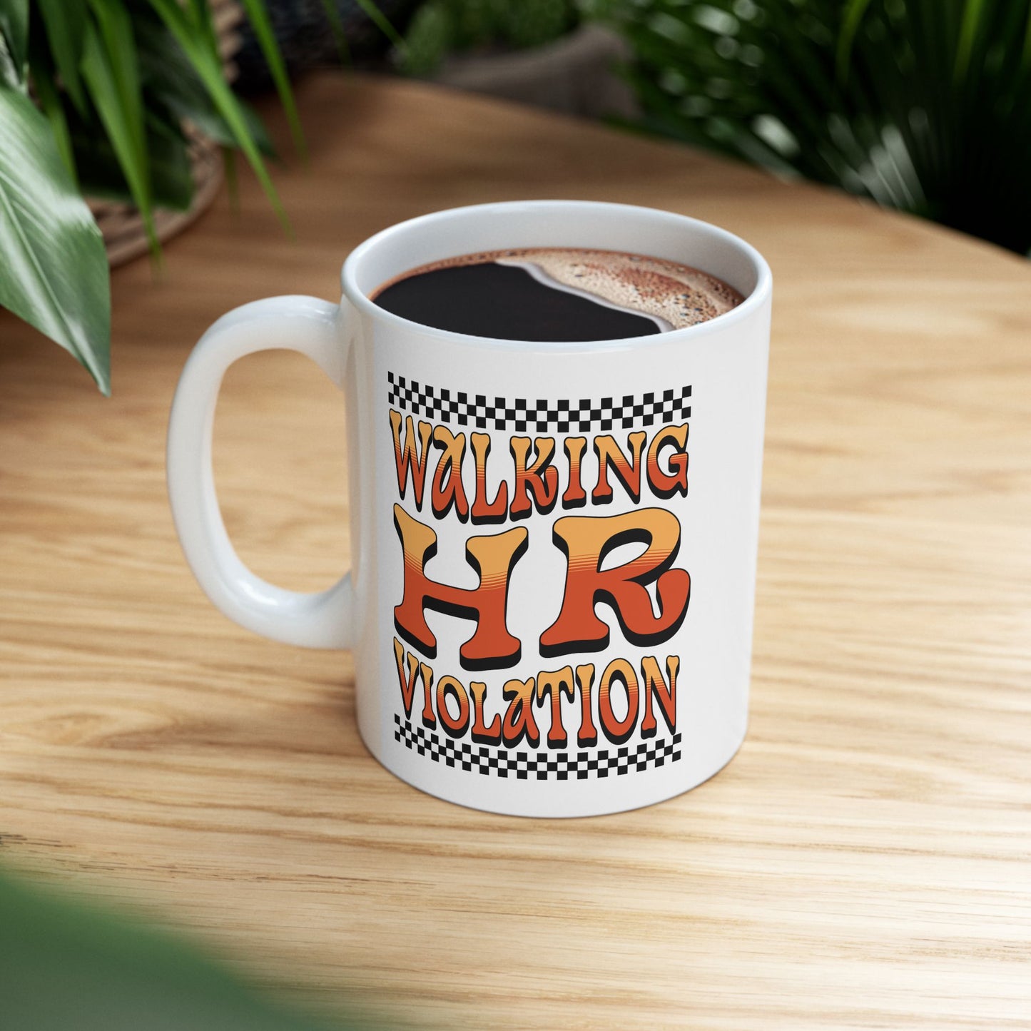 “Teezoca Walking HR Violation mug on table, funny workplace meme office coffee cup”

