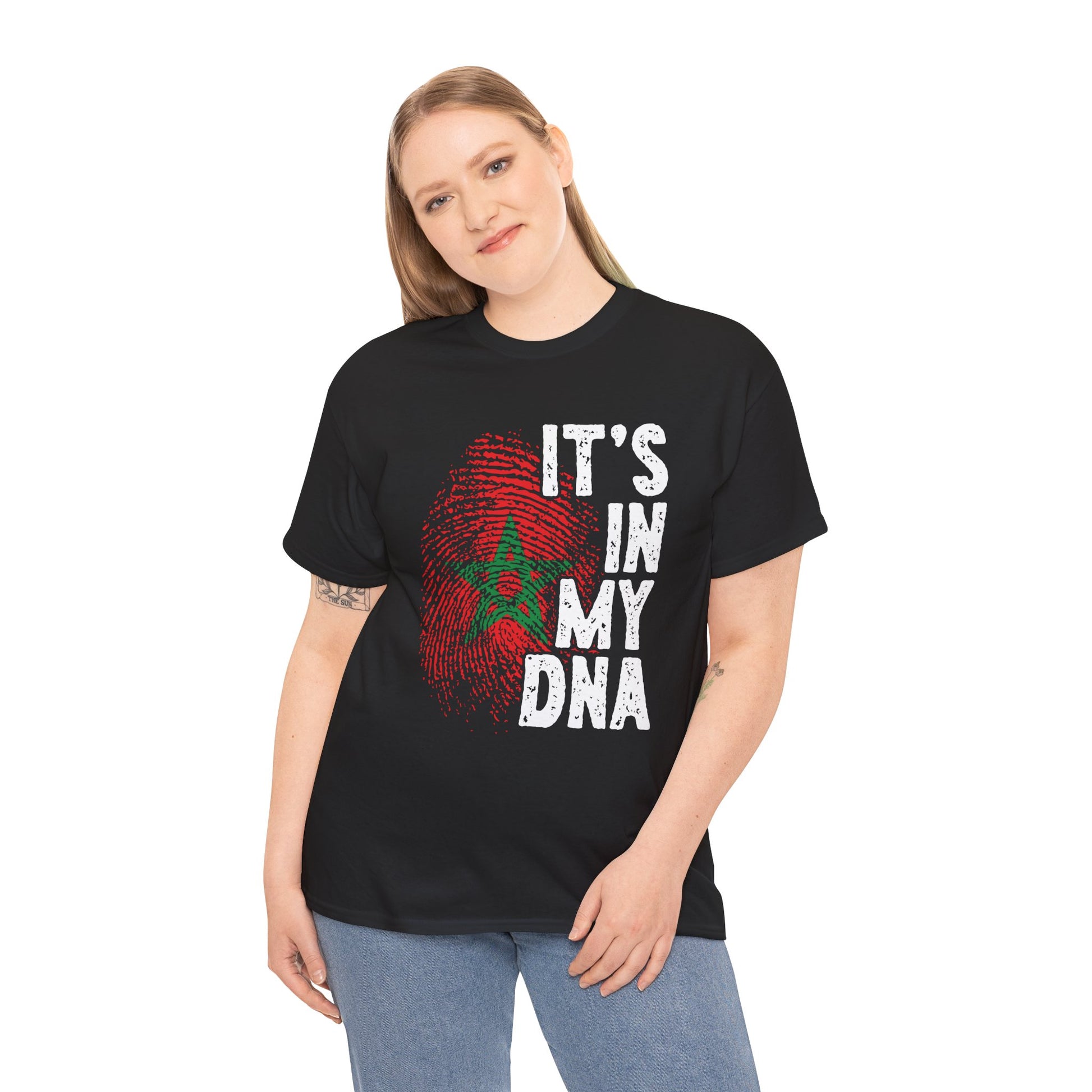 women wearing dark T-shirt featuring a red and green fingerprint in the design of the Moroccan flag with the star symbol, paired with the phrase "It's In My DNA," a Moroccan pride heritage shirt and cultural identity tee.


